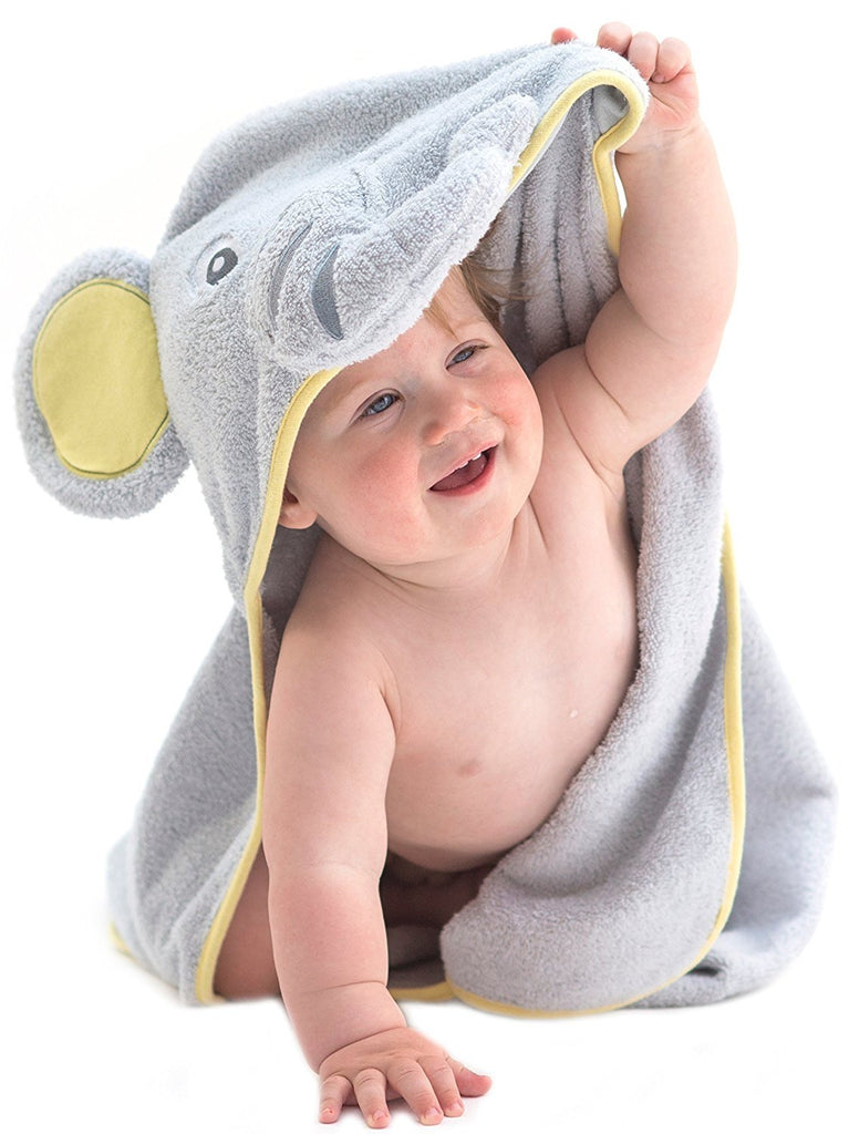 Alt = Baby facing forward wearing hooded towel with elephant hood