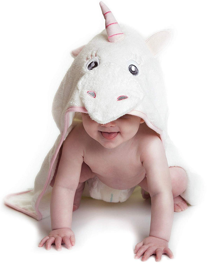 Alt = Baby leaning forward wearing Pink Unicorn hooded towel