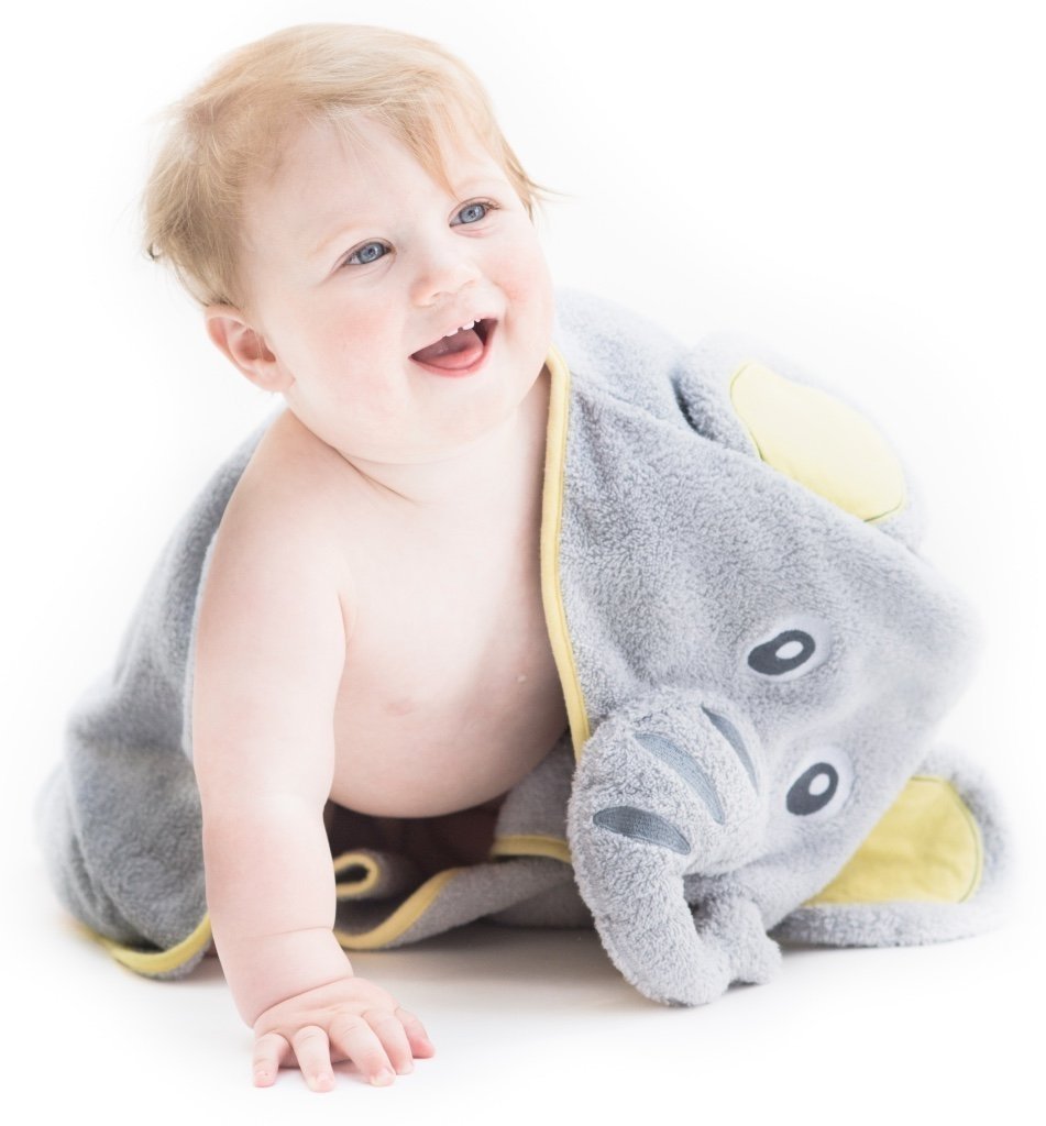 Alt = Smiling baby facing forward wearing hooded towel with elephant hood draped over shoulder